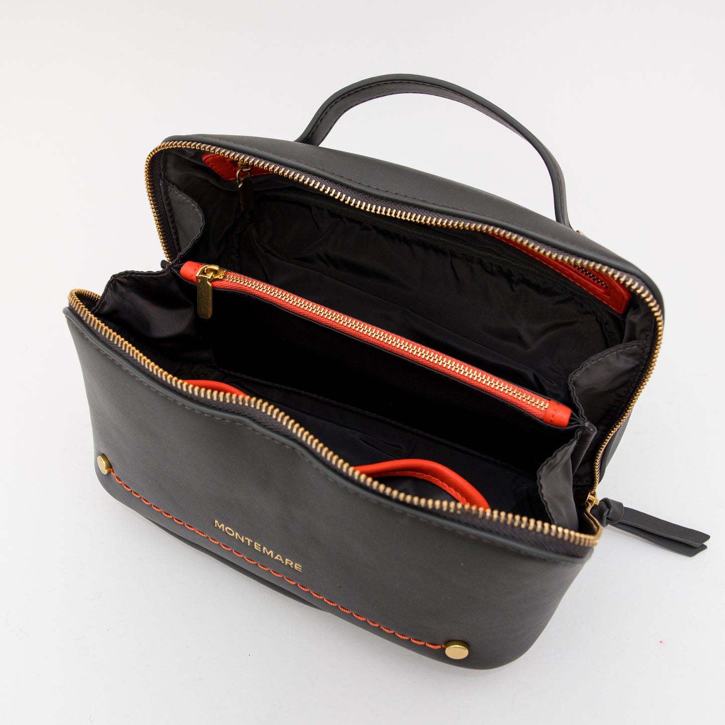 Montemaré Foldout Toiletry Case in Slate opened with orange trim inside