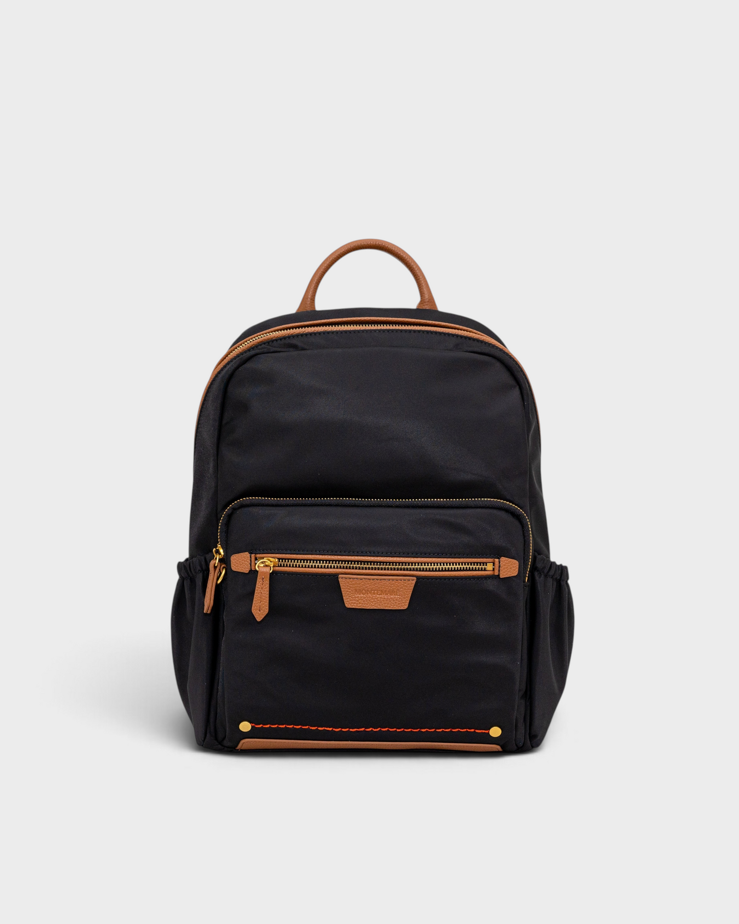 Montemaré Oslo premium black nylon and leather backpack with RFID-blocking pockets and gold zipper details.