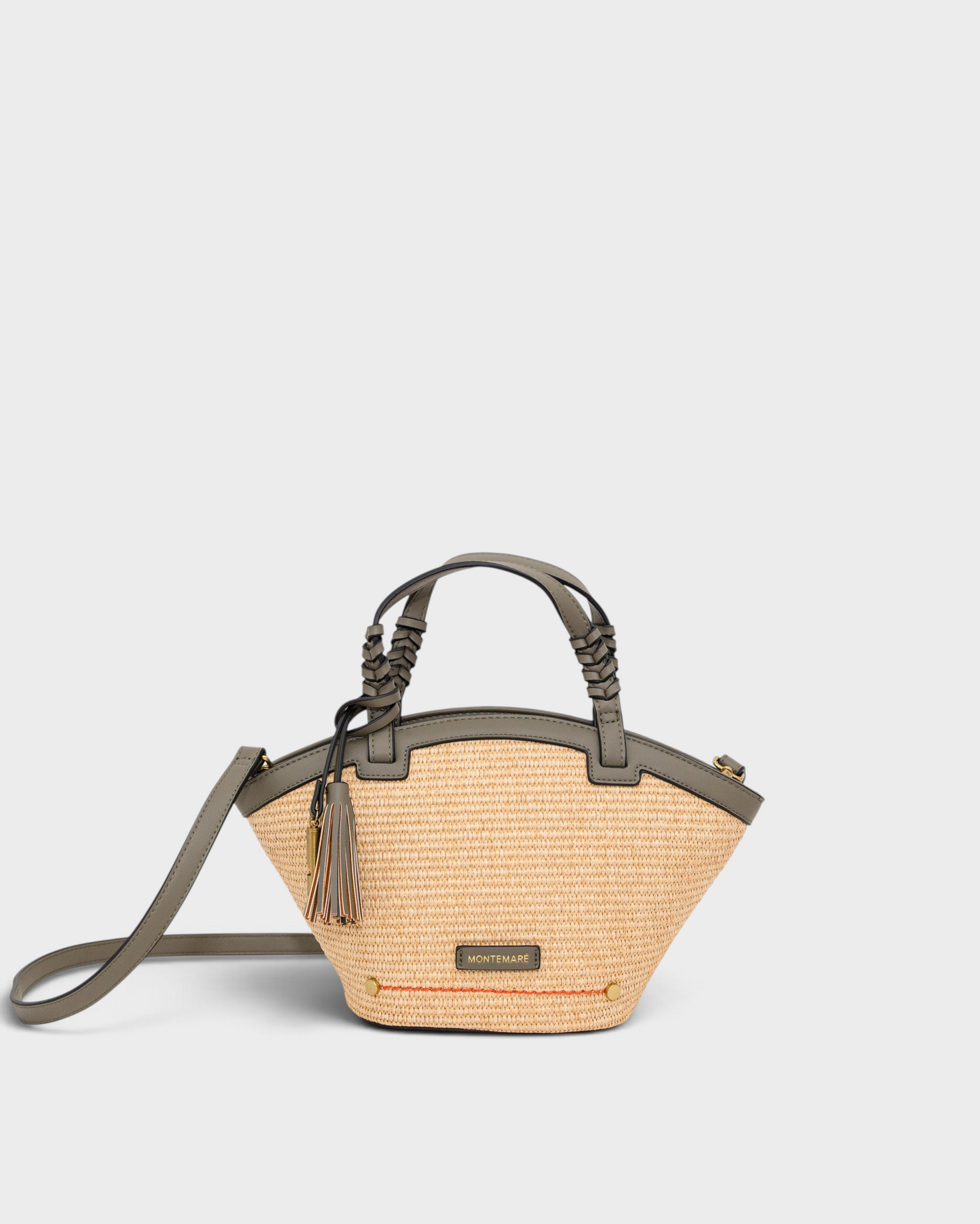 Montemaré Palma Crossbody bag in straw-like material with grey vegan leather trim, top handles, and tassel detail.