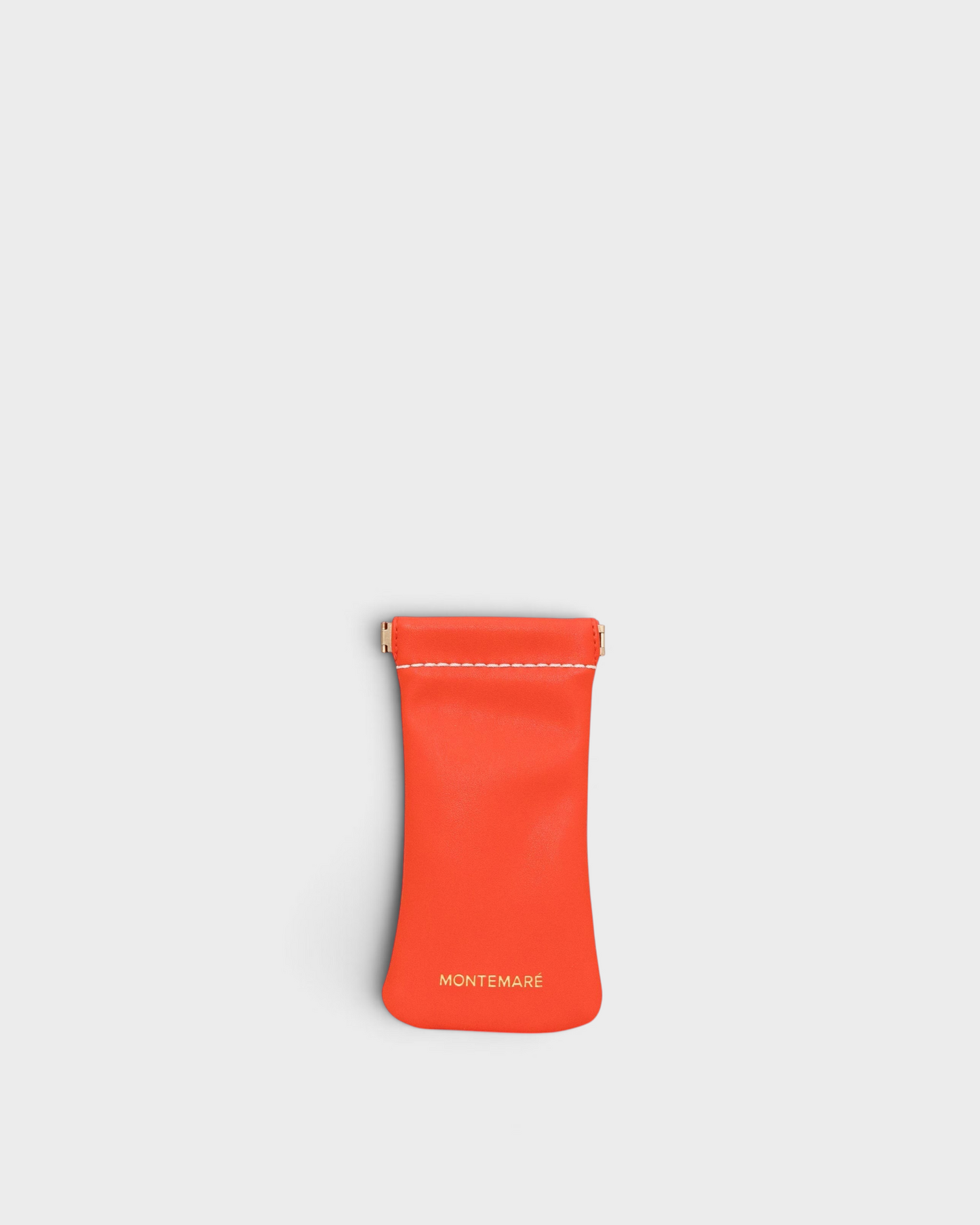 Montemaré Roma glasses case in vibrant orange vegan leather with a convenient spring-frame closure.