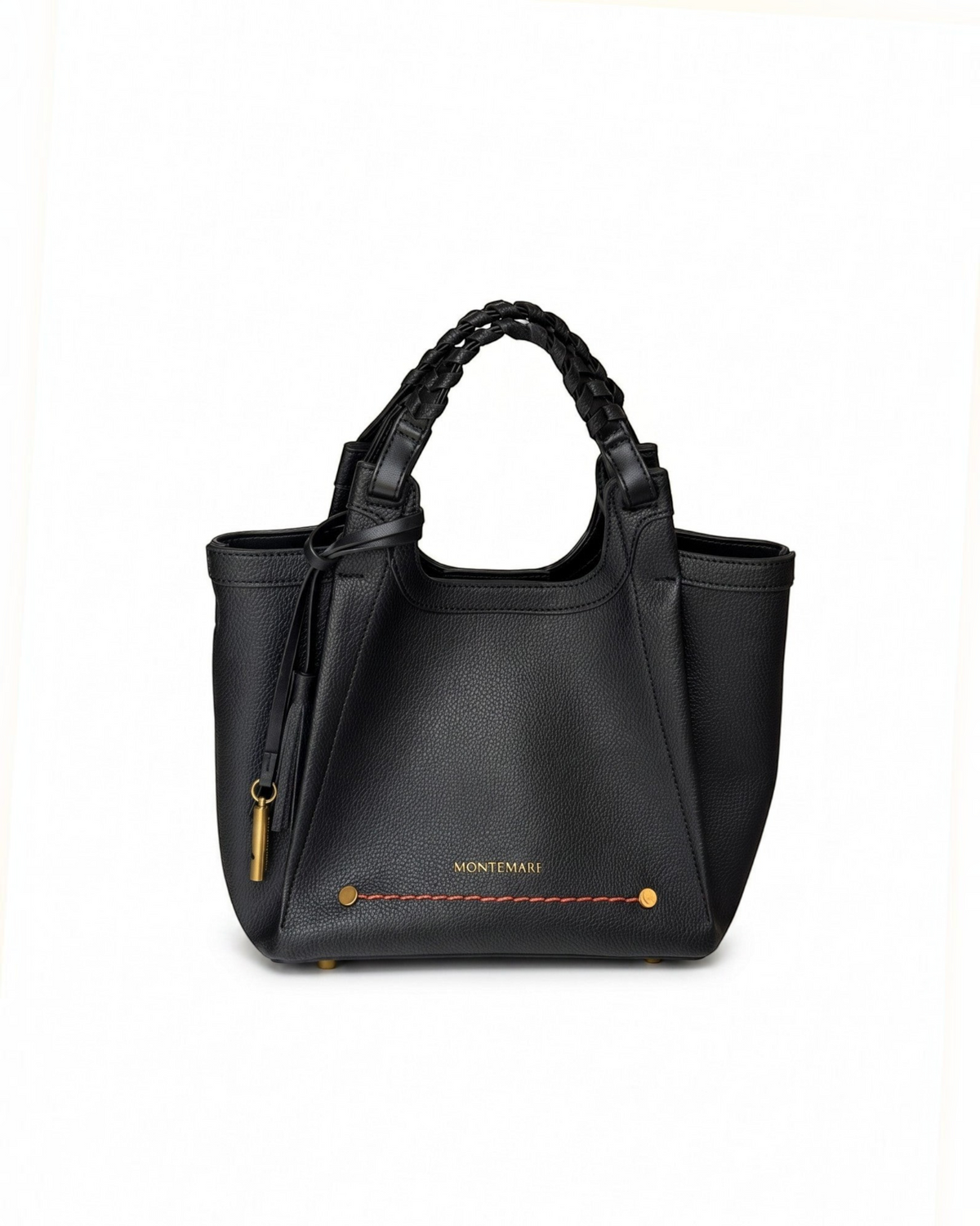 Montemaré Sedona Crossbody bag in black pebbled vegan leather with a braided handle and signature whistle tassel.