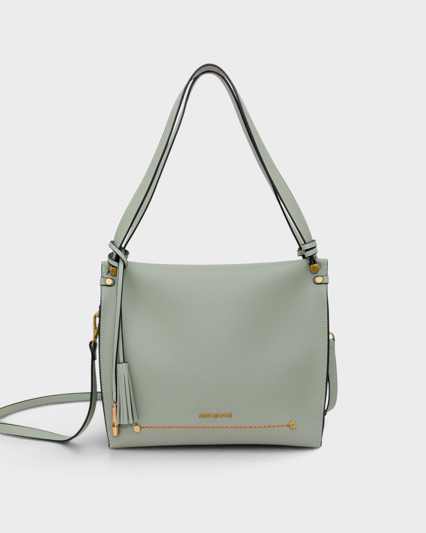 Montemaré Vienna shoulder bag in sage green pebbled vegan leather with a signature safety whistle tassel and gold hardware