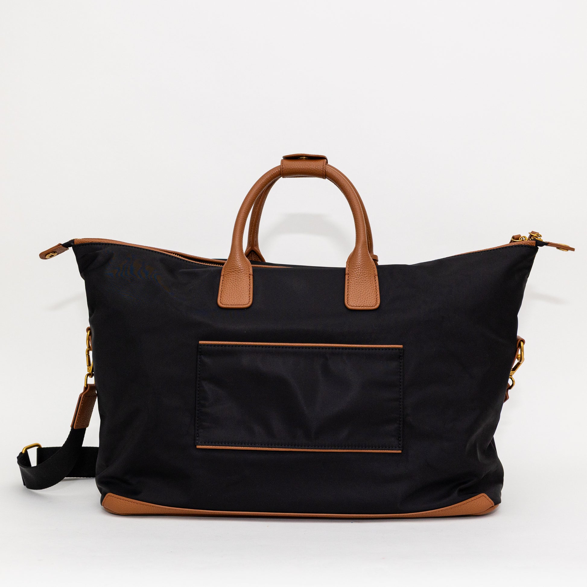 Black carry on bag with brown handles and accents on a white background