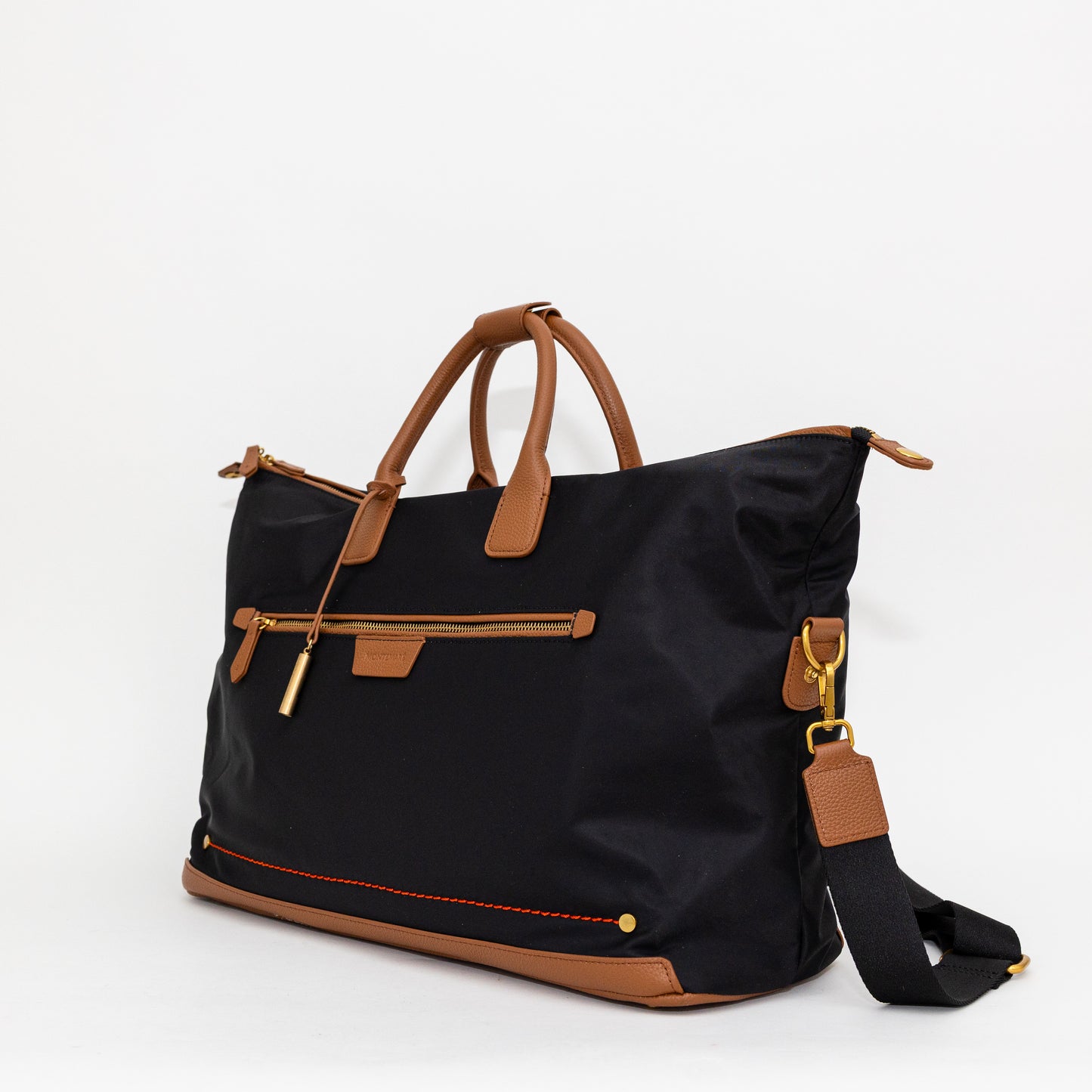 Black carry on bag with brown handles and straps on a white background