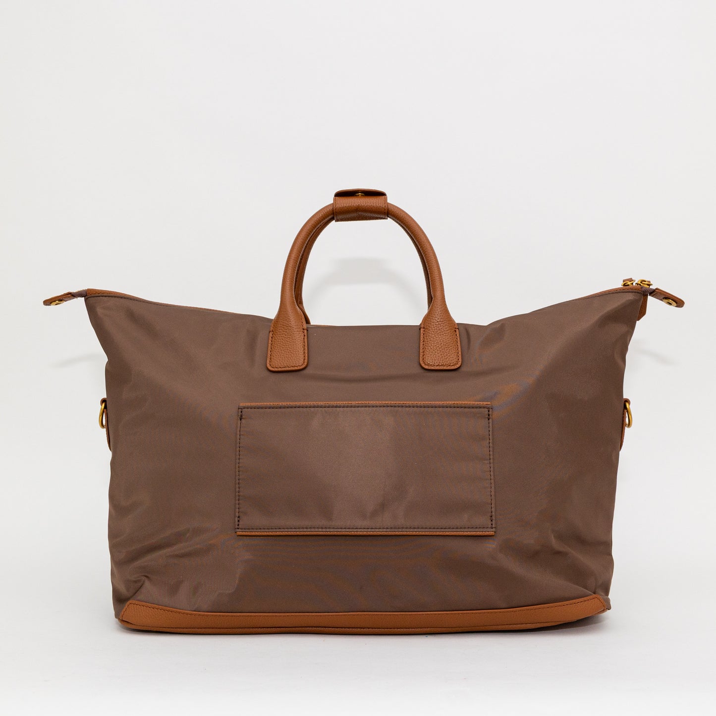 Brown carry on bag with leather handles and trim on a white background