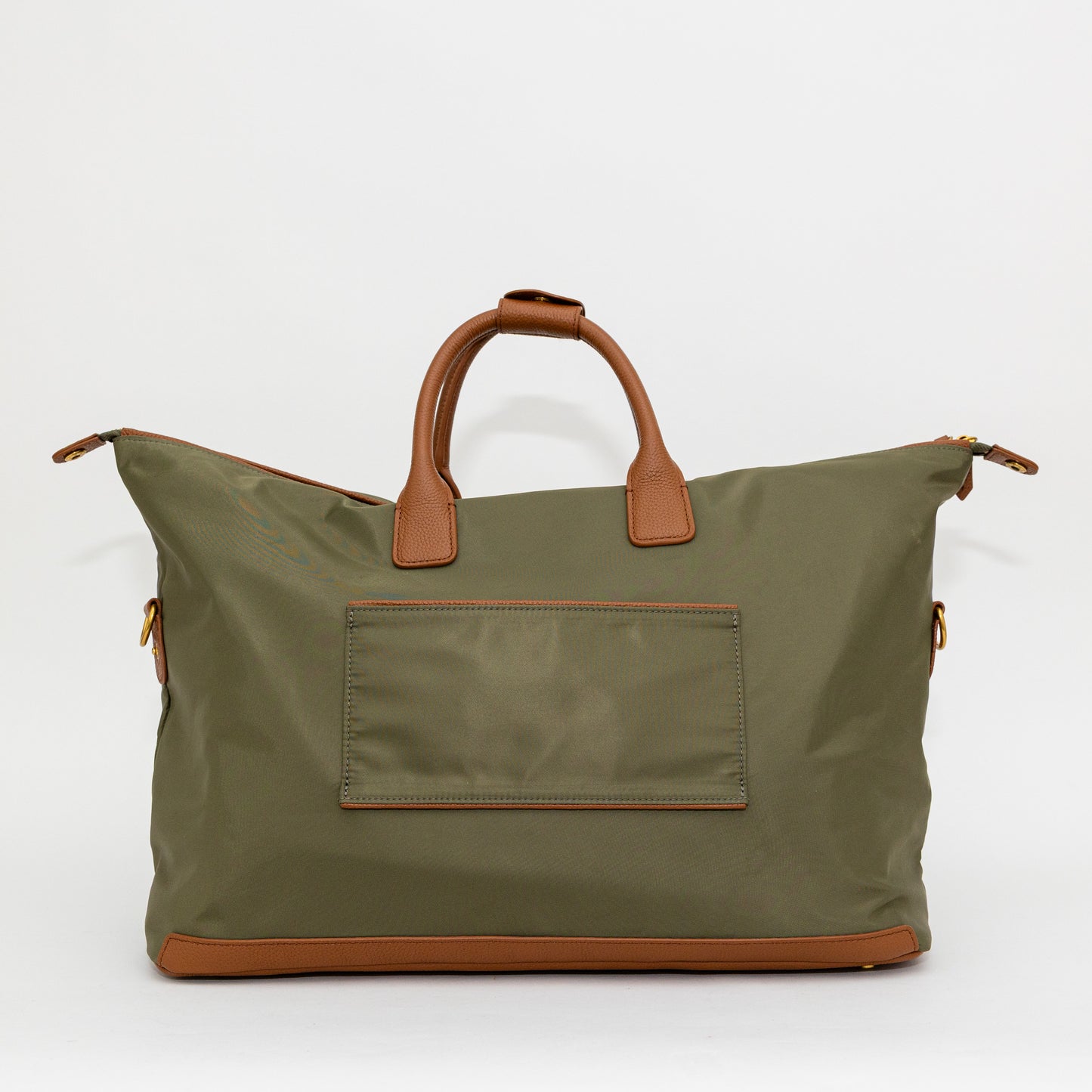 Green carry on bag with brown handles and trim on a white background