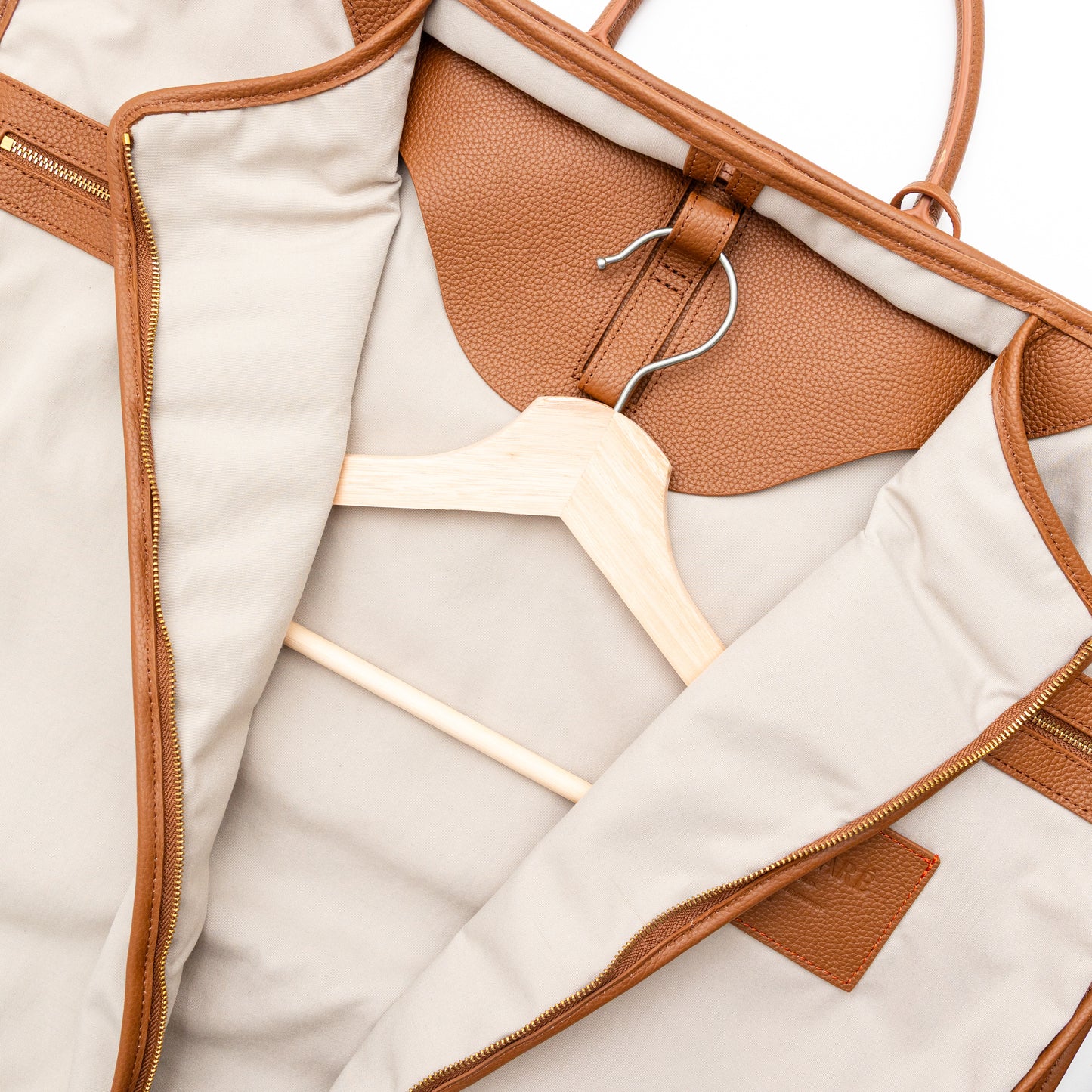 Interior of a garment bag with a hanger on a white background