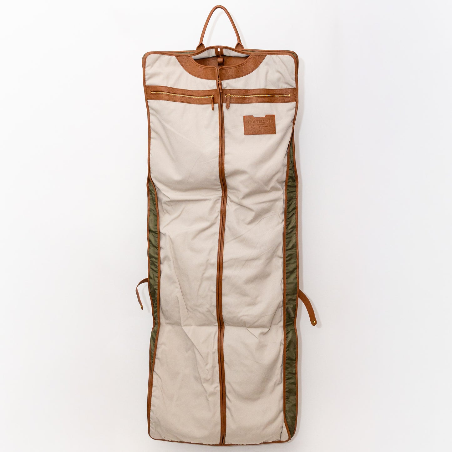 Garment bag interior with brown leather straps on a white background