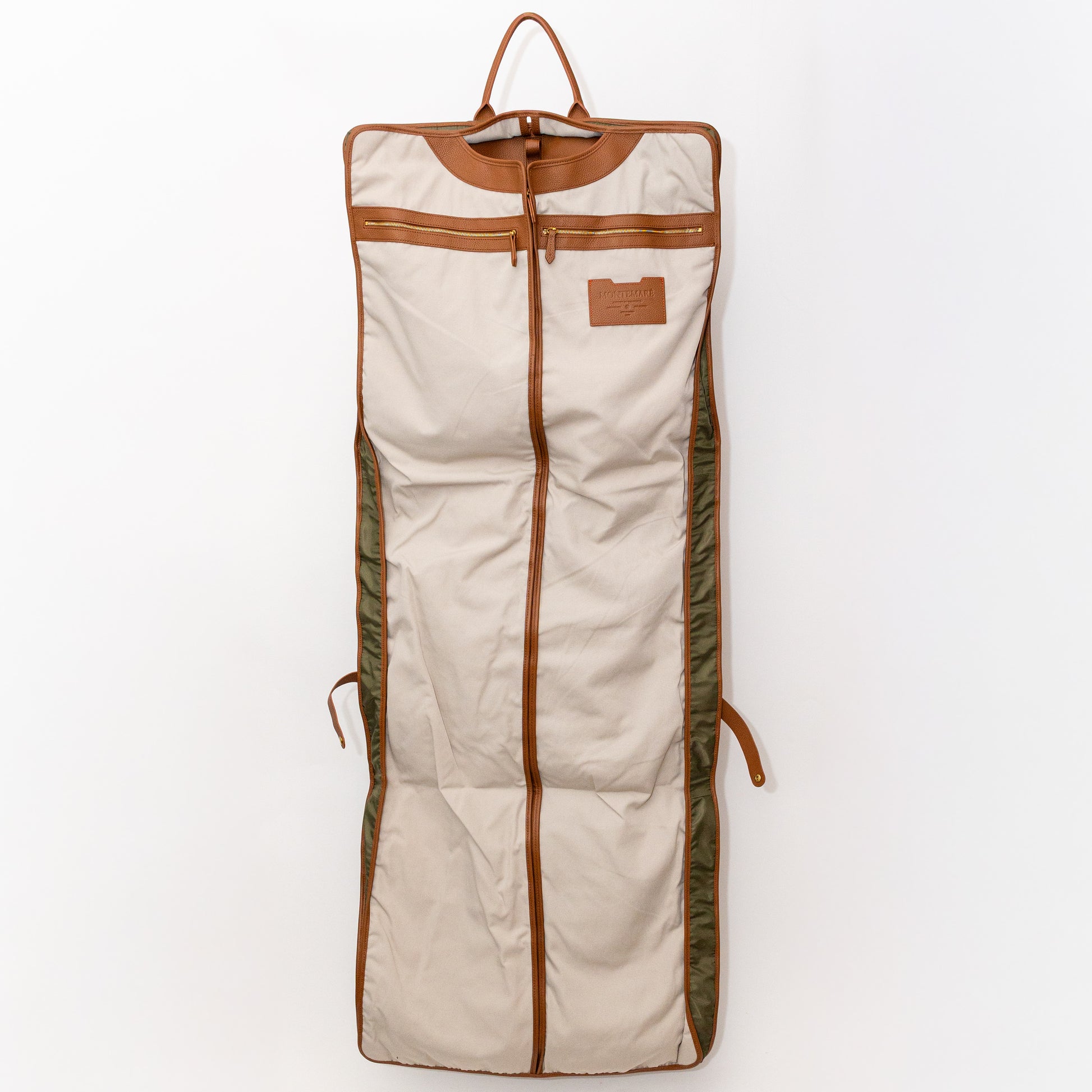 Garment bag interior with brown leather straps on a white background