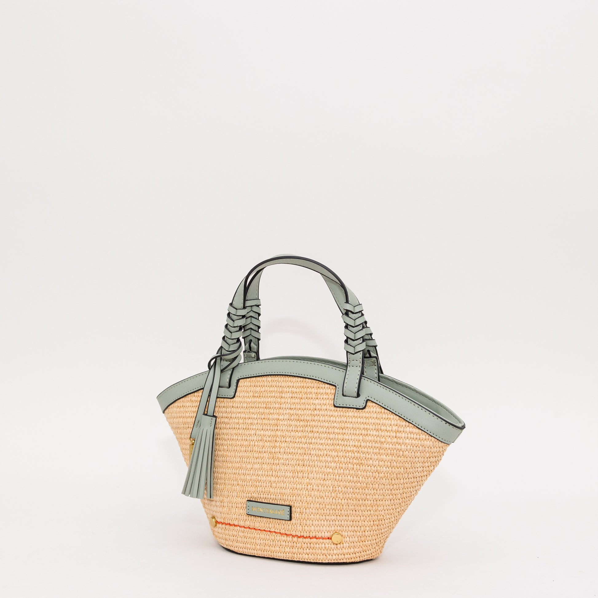 Woven handbag with blue accents on a white background