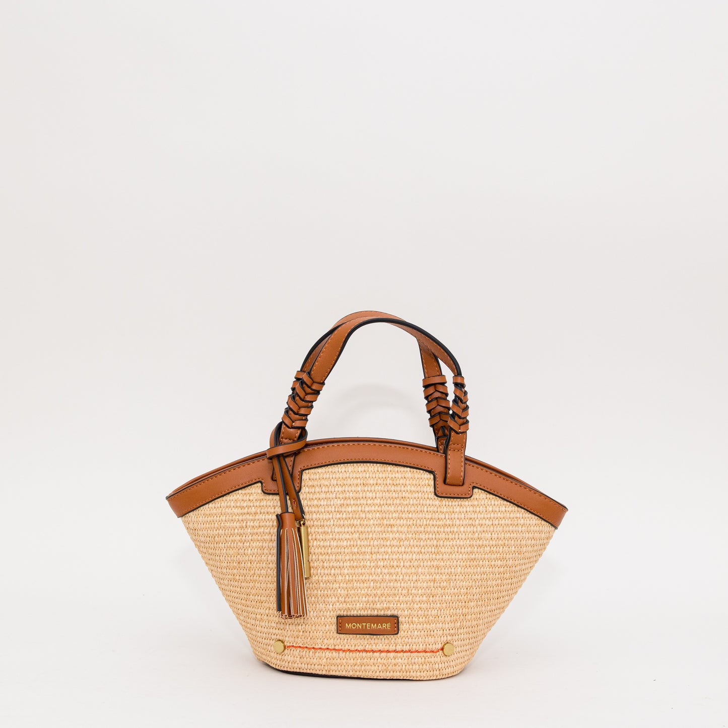 Woven handbag with cognac leather accents on a white background