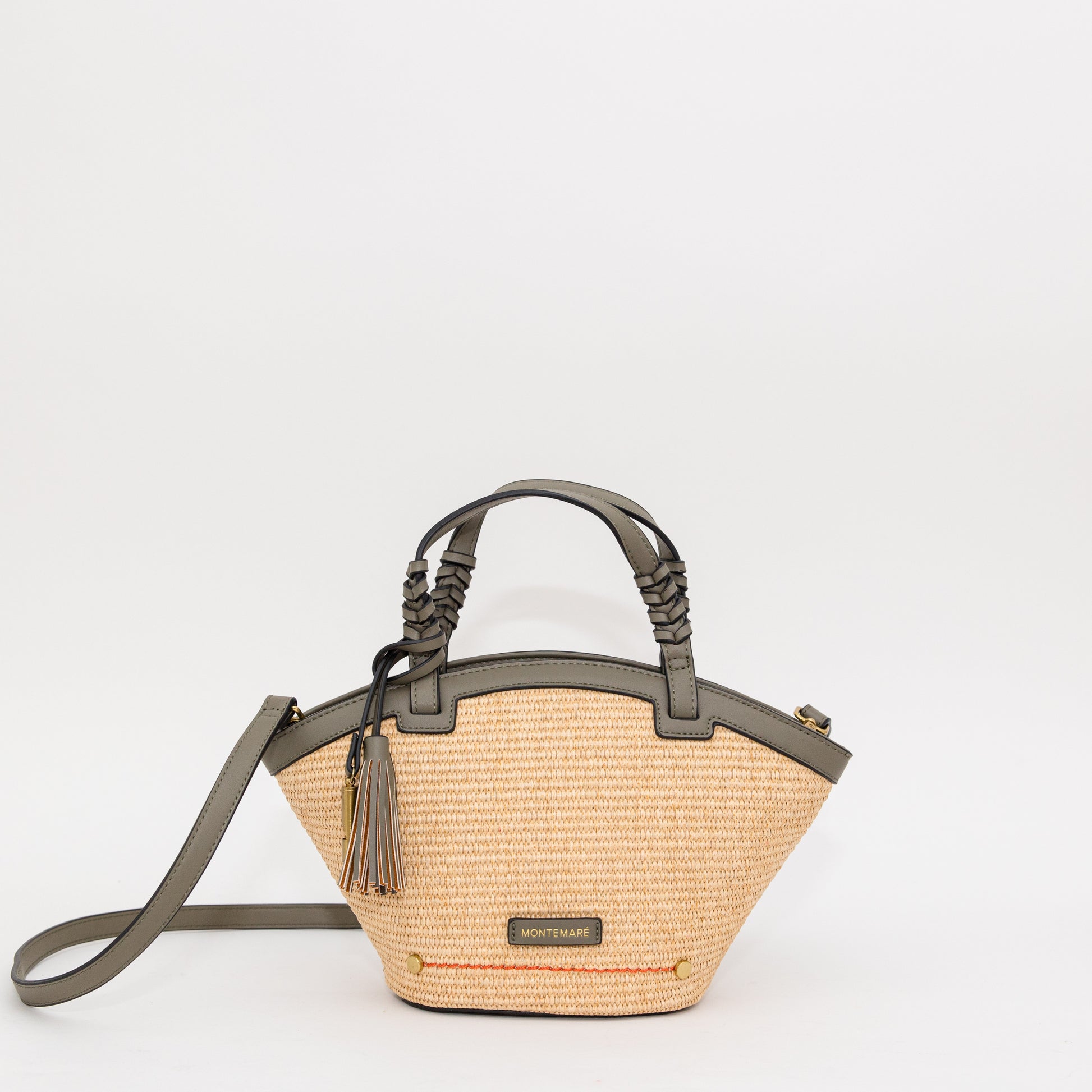 Woven handbag with gray leather accents on a white background
