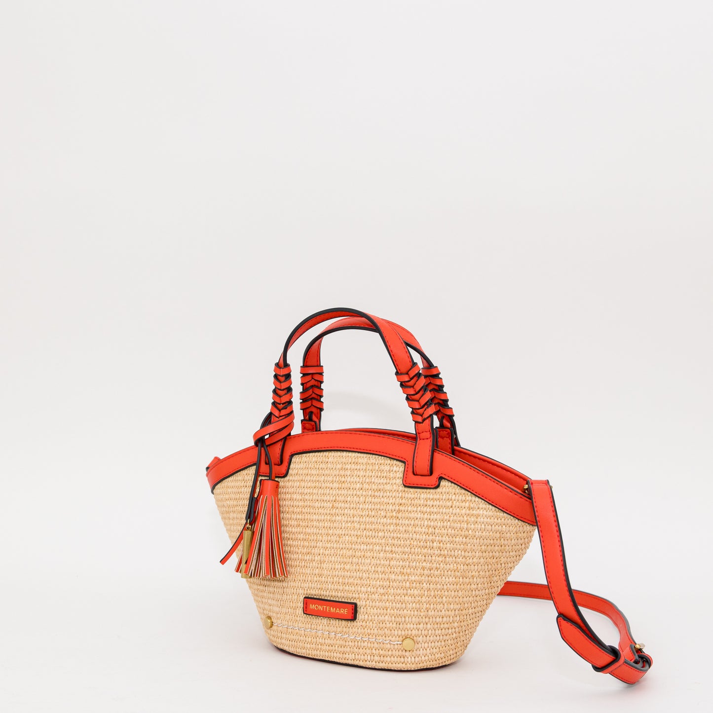 Woven handbag with orange accents on a white background