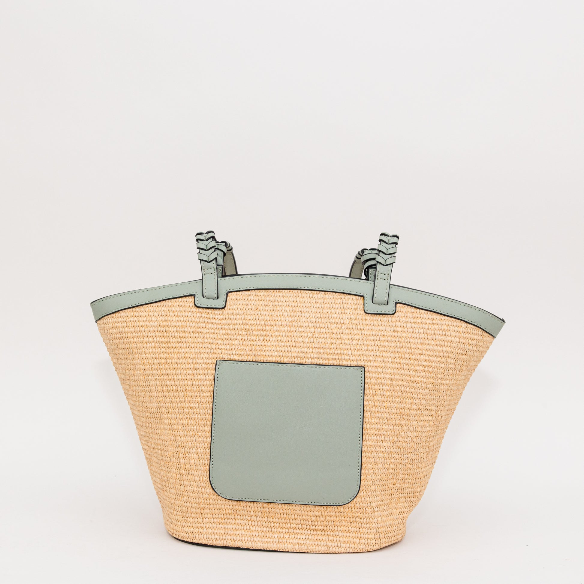 Woven handbag with a light blue pocket on a white background