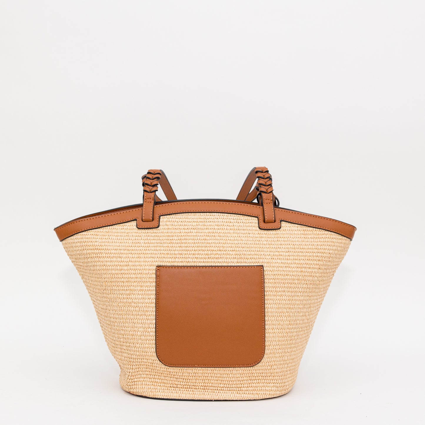 Woven bag with cognac leather accents on a white background