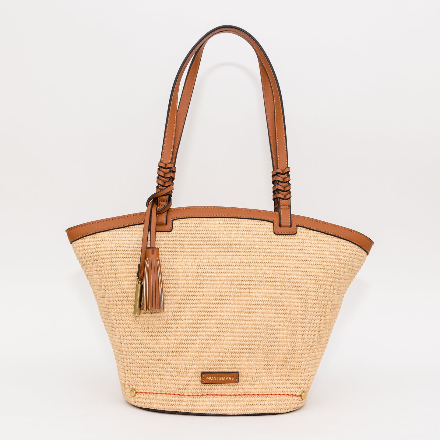Woven handbag with cognac leather accents on a white background