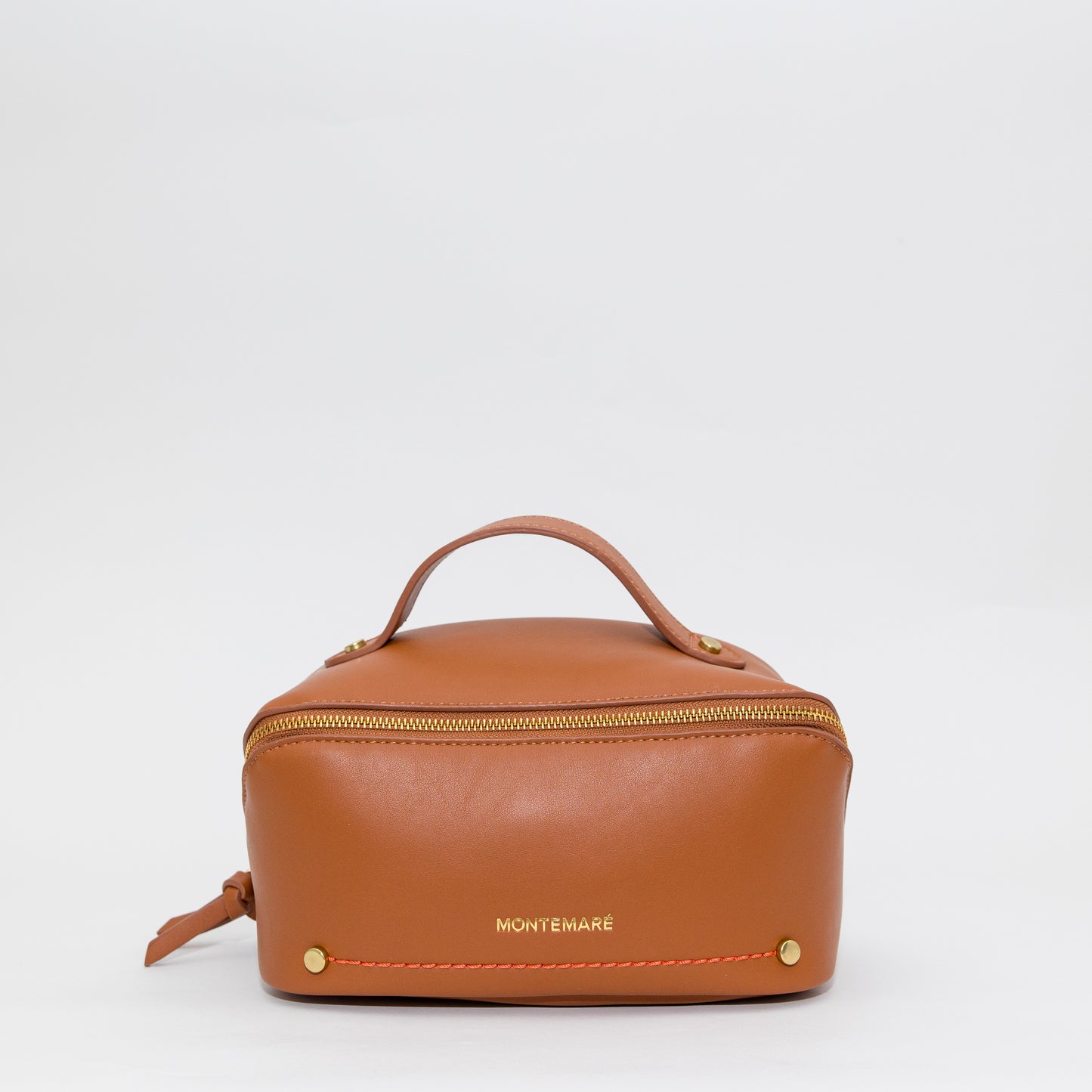 Brown leather toiletry bag with 'Montemare' branding on a white background