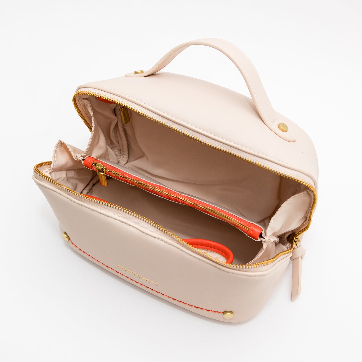 Ivory toiletry case with open front zipper on a white background