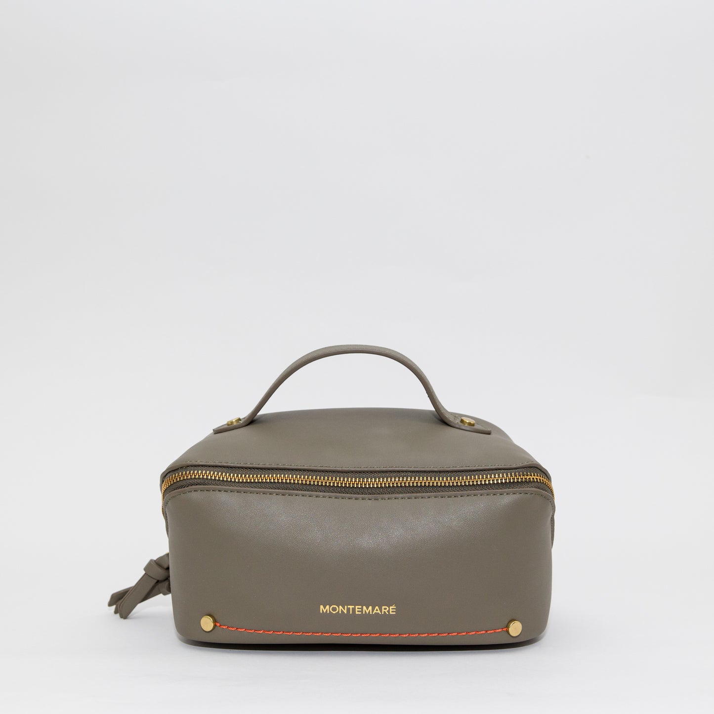 Brown leather toiletry bag with 'Montemare' branding on a white background