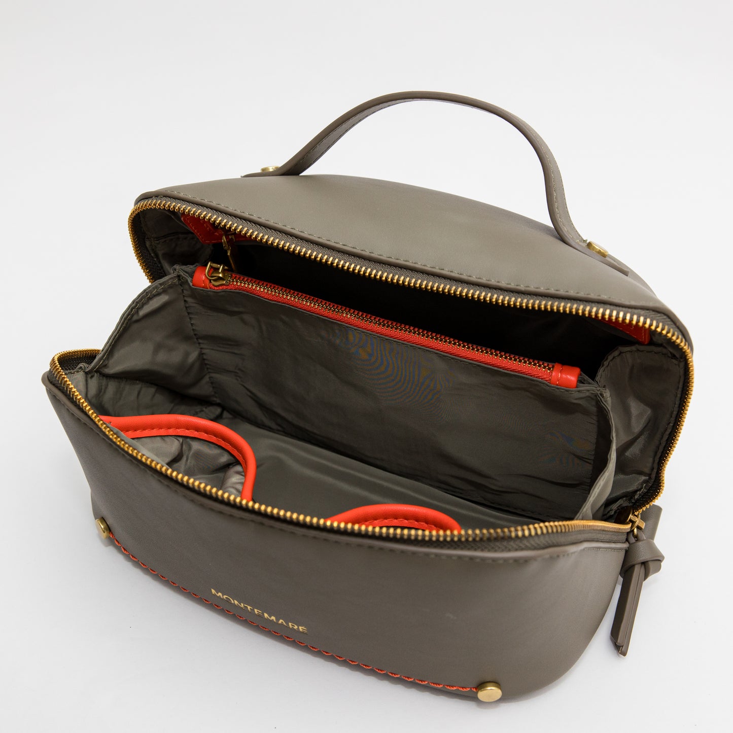 Open olive green leather bag with orange interior on a white background