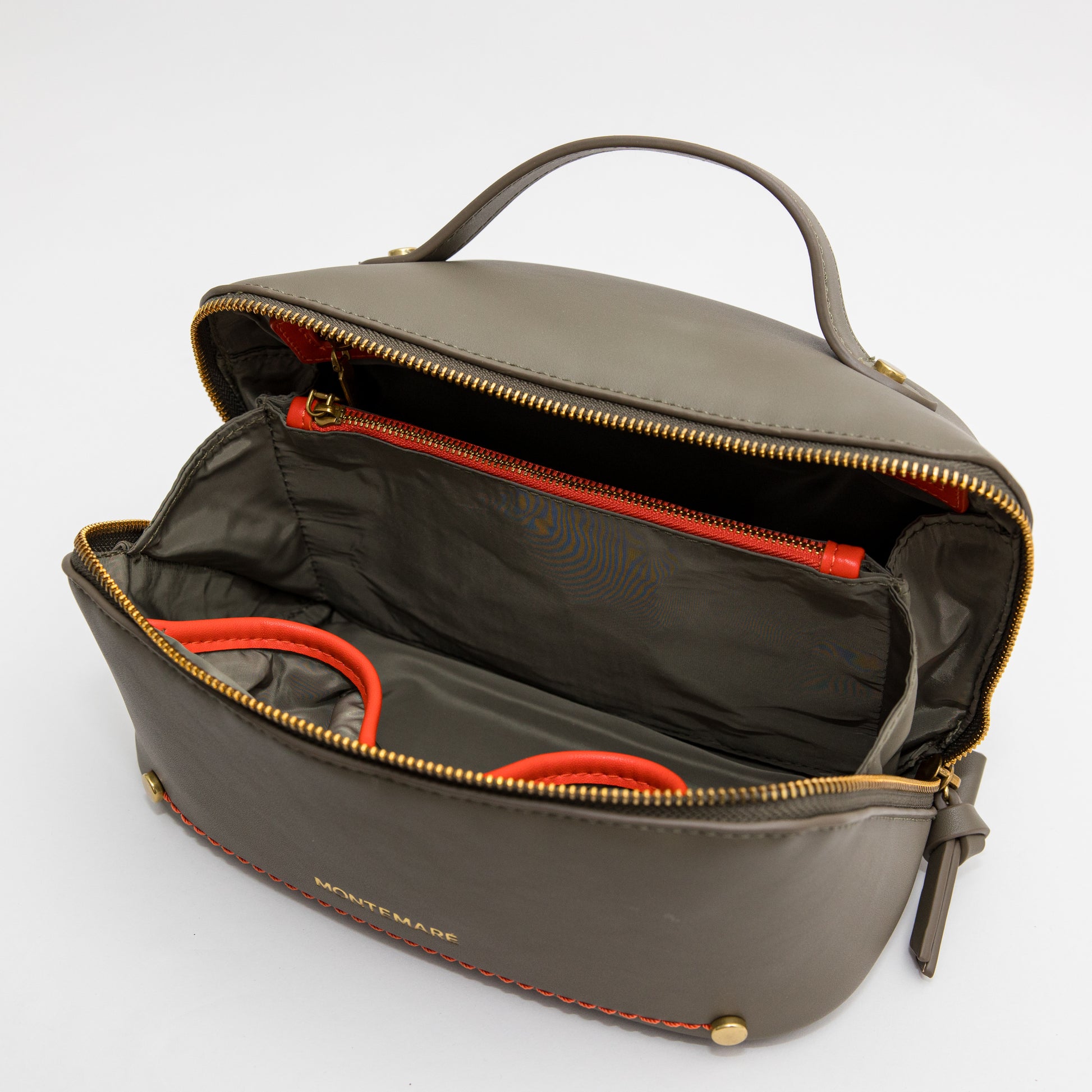 Open olive green leather bag with orange interior on a white background