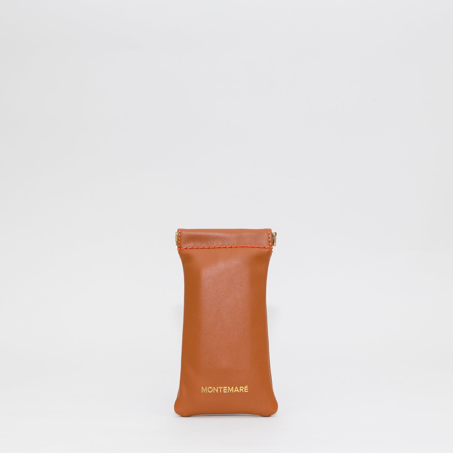 Brown leather pouch with 'Montemare' branding on a white background
