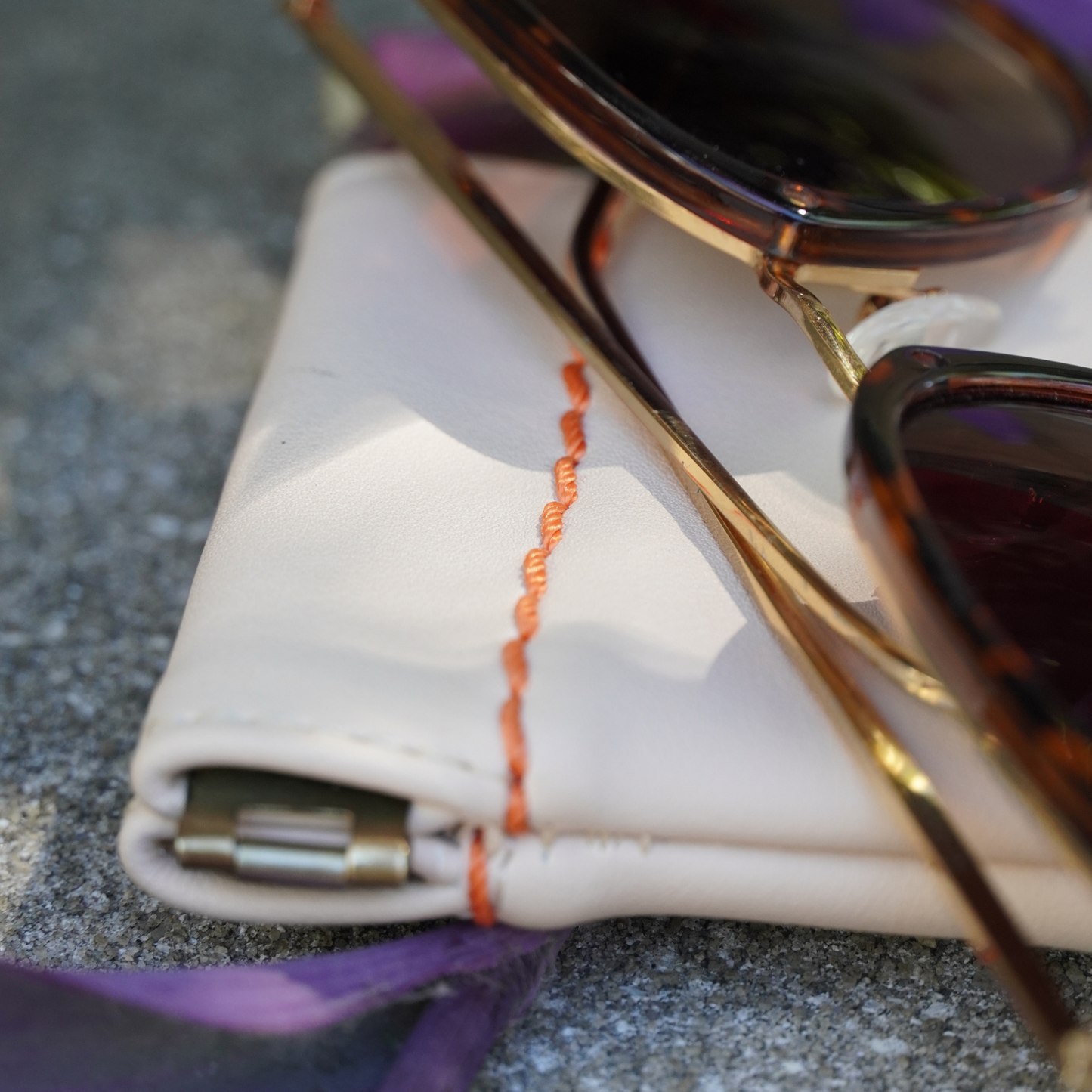 Styled photo of Montemare Roma glasses case with sunglasses on top