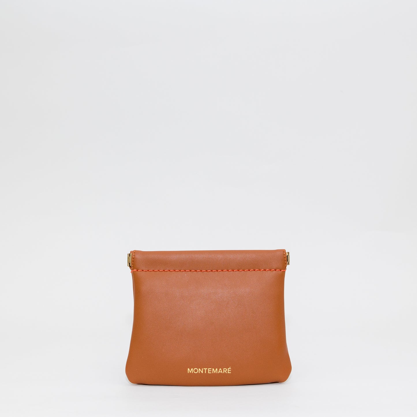 Brown leather pouch with 'Montemare' branding on a white background