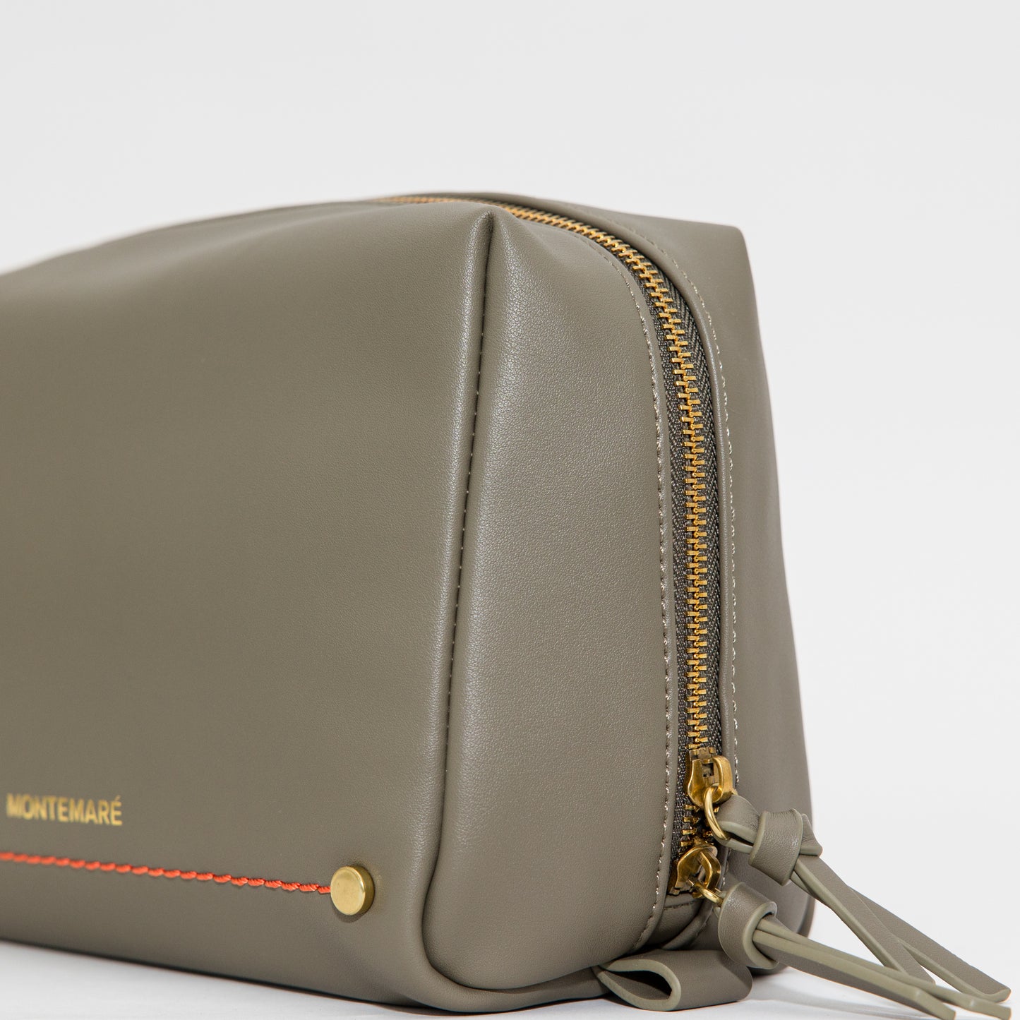 Olive leather bag with gold zipper and trim on a white background