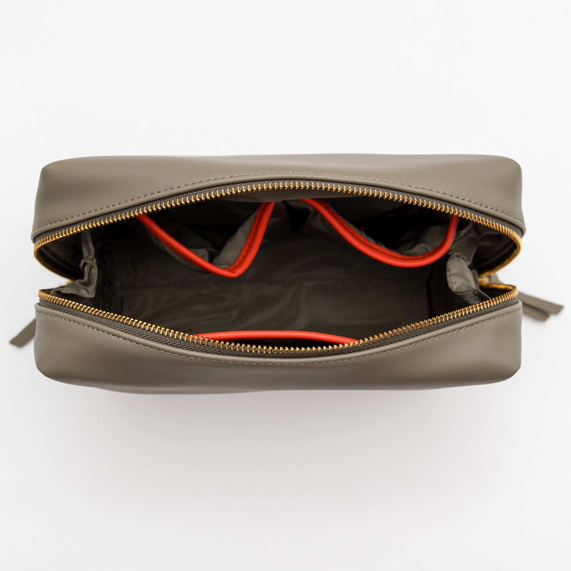 Open gray leather bag with orange interior lining on a white background