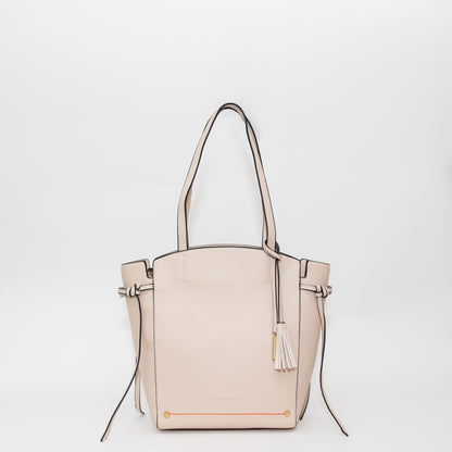 Beige handbag with a tassel on a white background