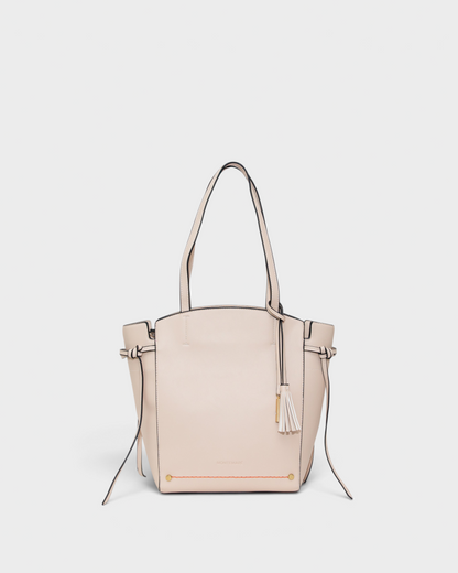 Beige handbag with a tassel on a white background