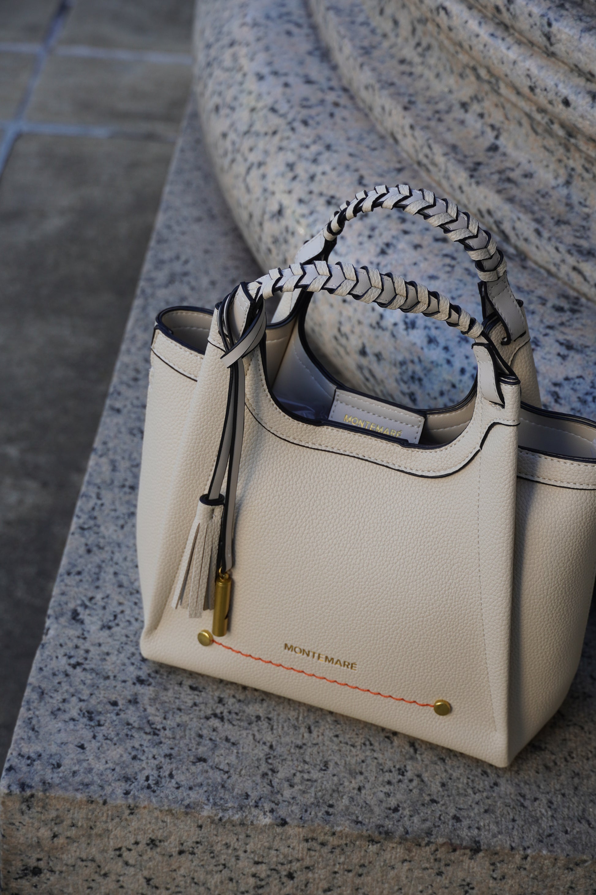 Sedona Crossbody bag in white on a pillar base