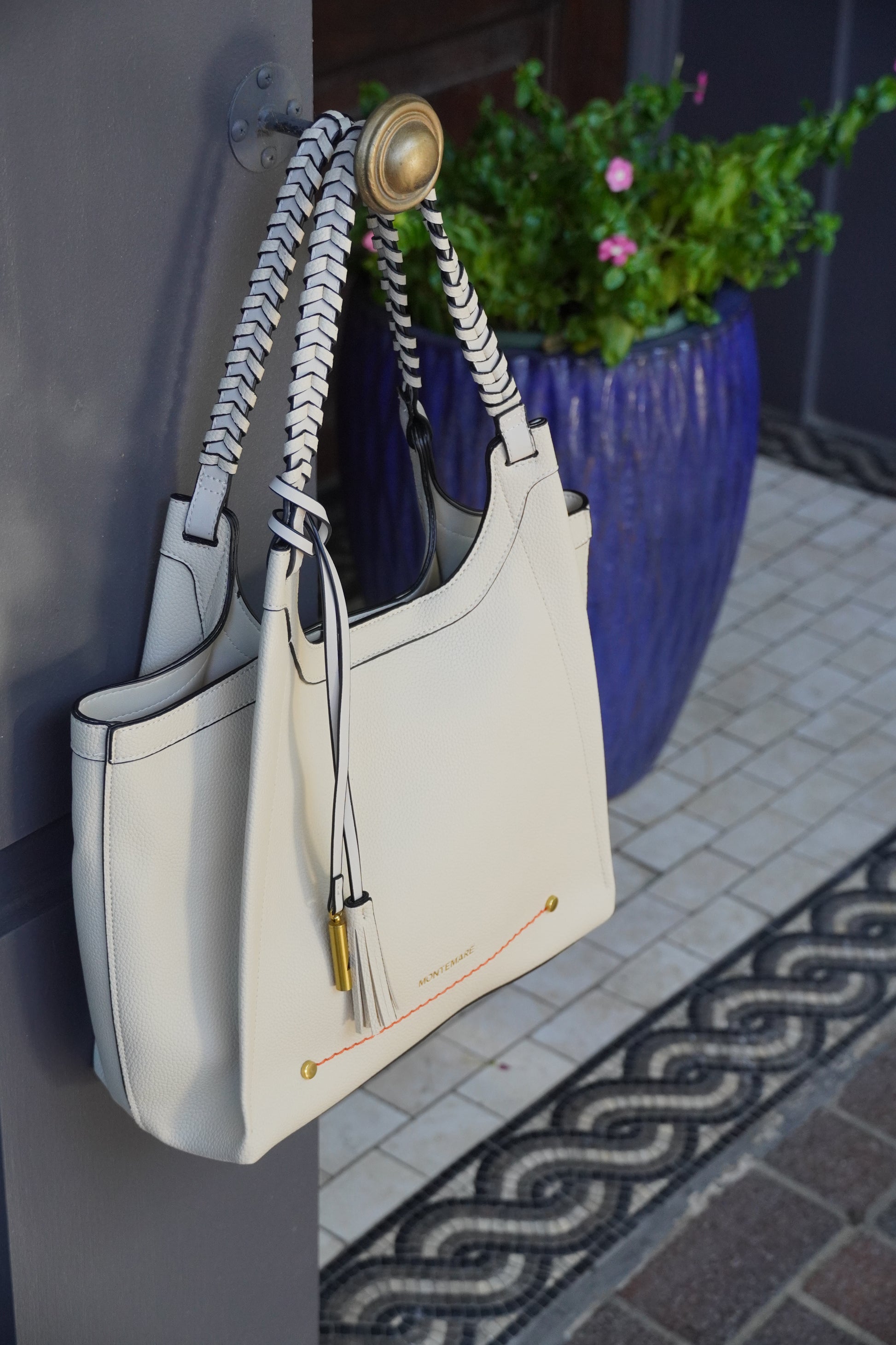 White bag with sophisticated design on a table outdoors