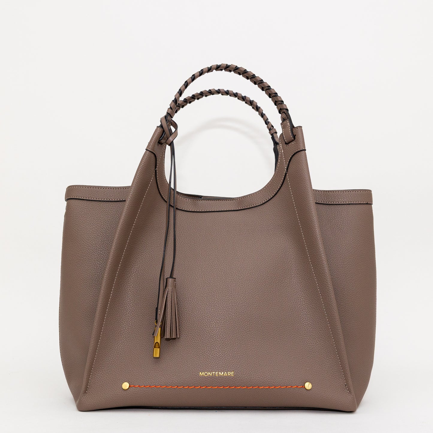 Brown handbag with braided handle and tassel on a white background