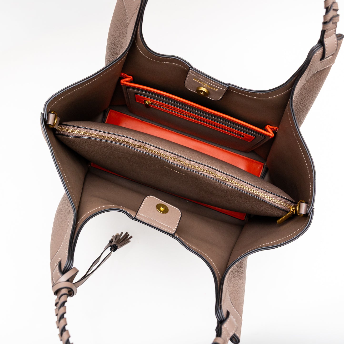 Open brown handbag with red interior on a white background