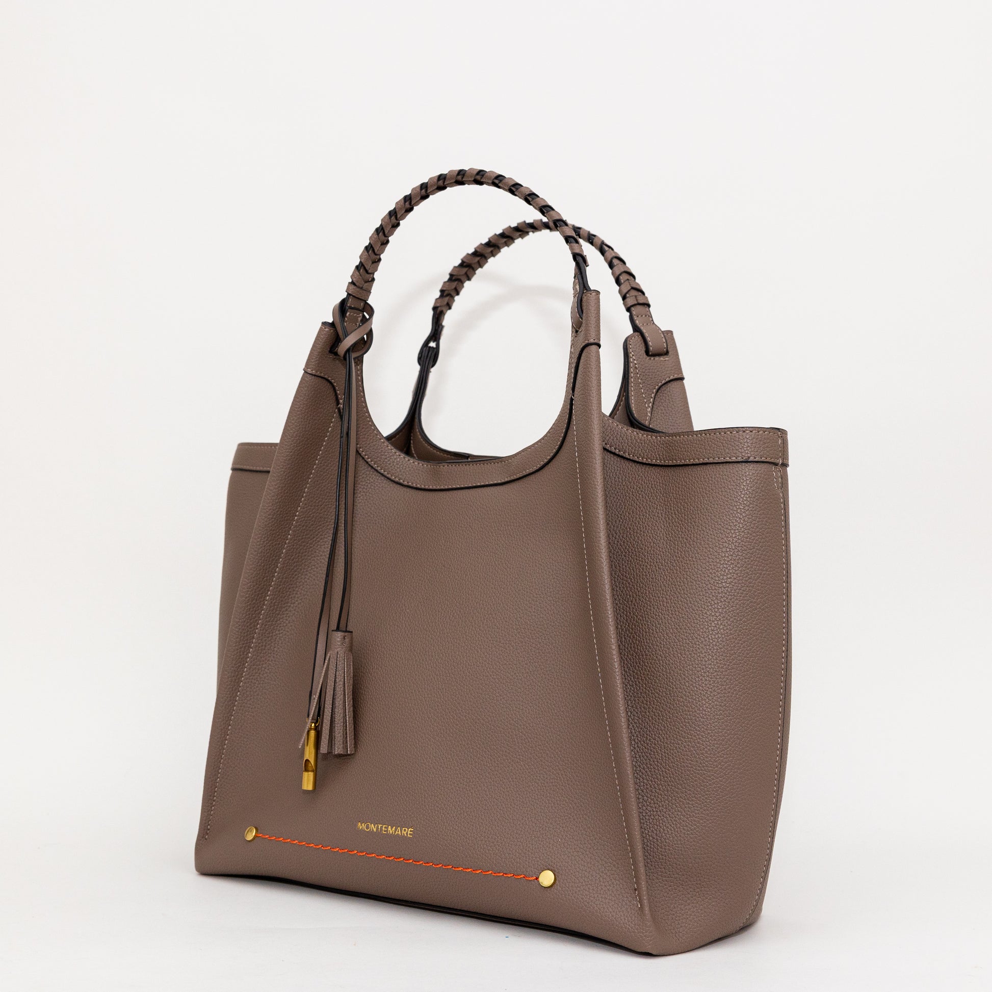 Brown handbag with braided handle on a white background