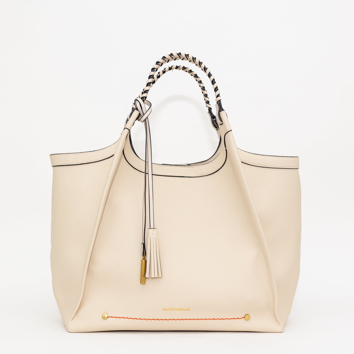 Cream handbag with decorative handle and tassel on a white background