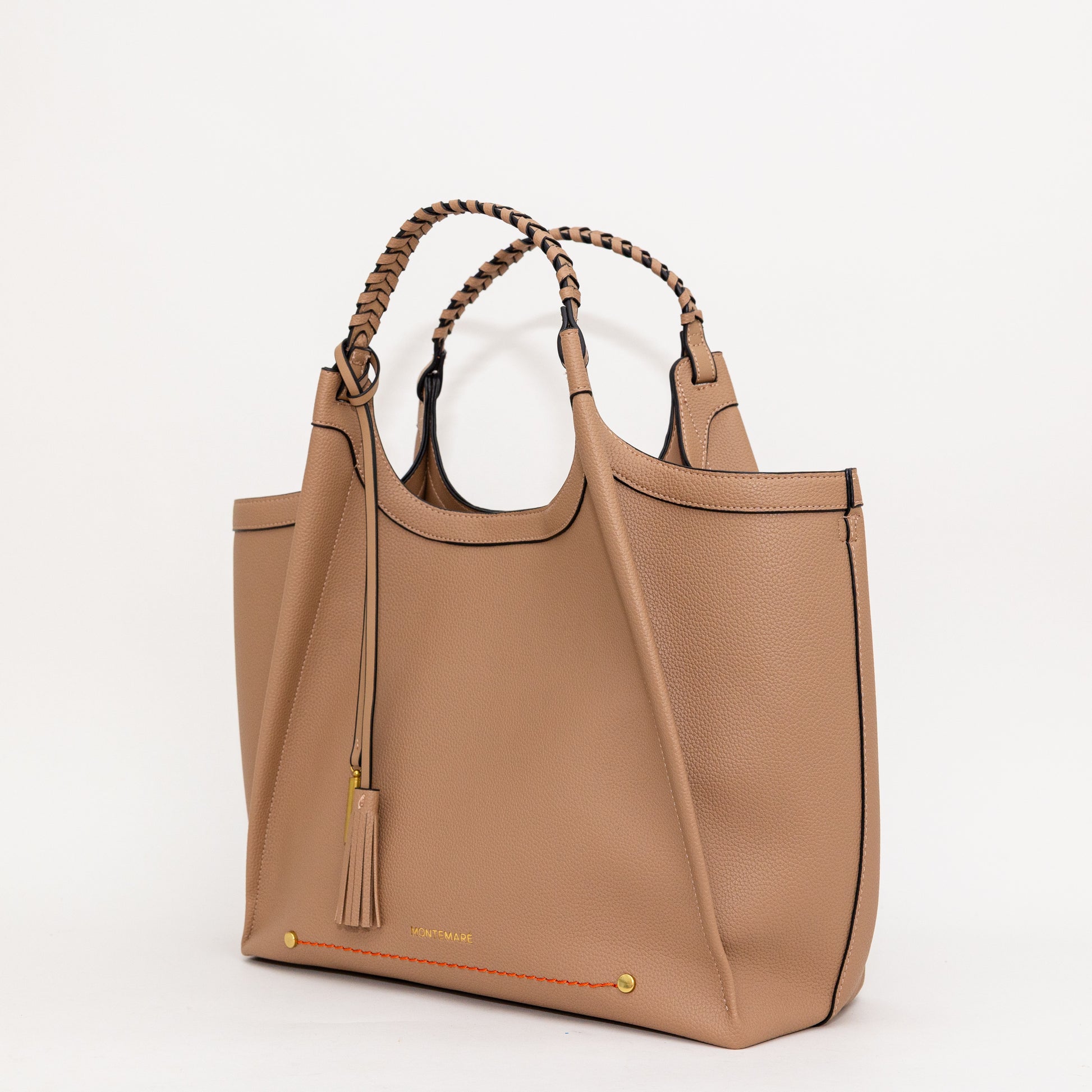 beige tote bag with braided handles on a white background