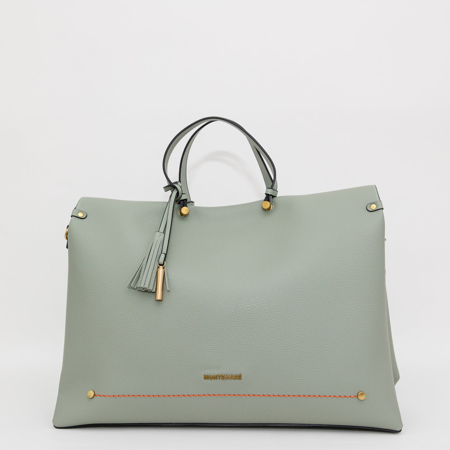 Light blue handbag with gold accents on a white background