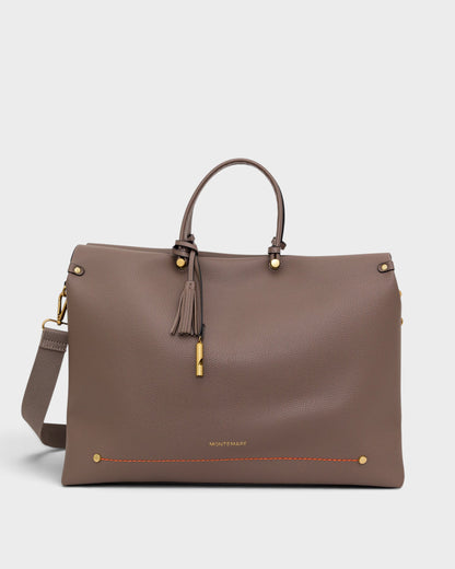 Brown handbag with gold accents on a white background
