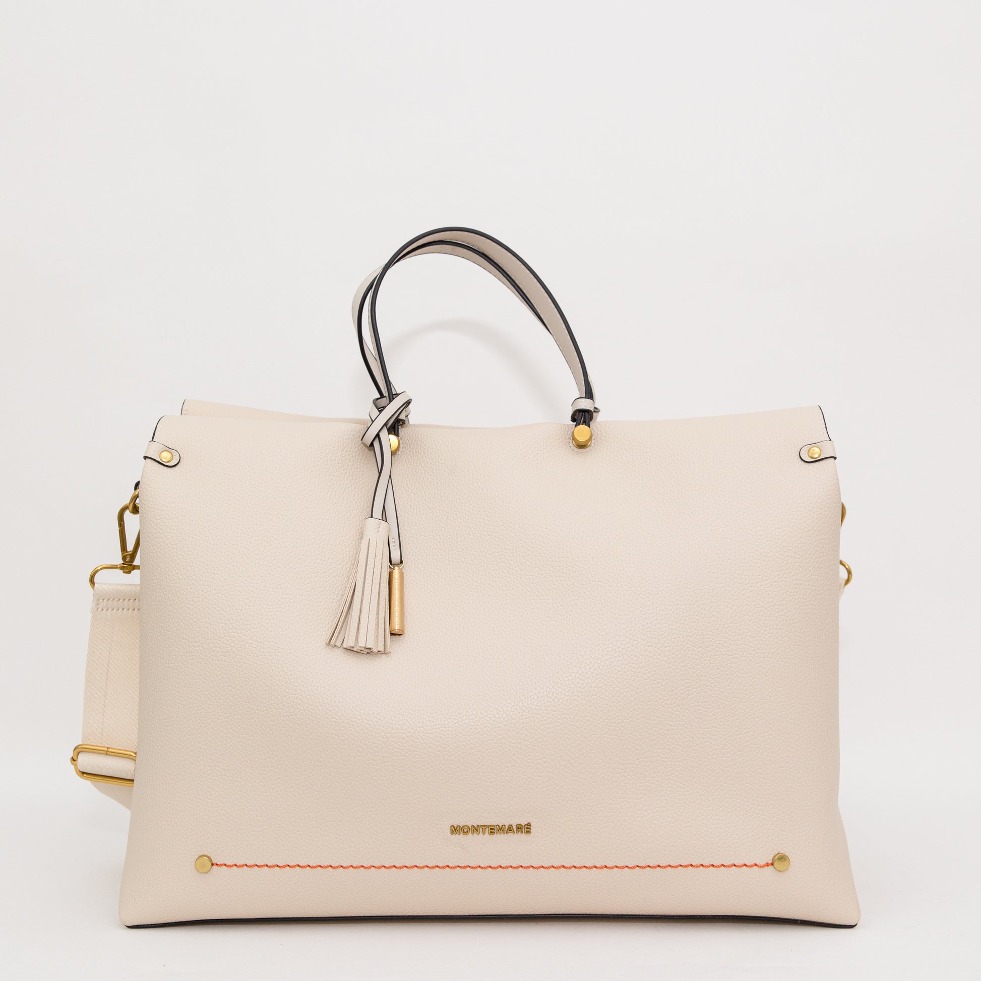 White handbag with gold accents on a white background