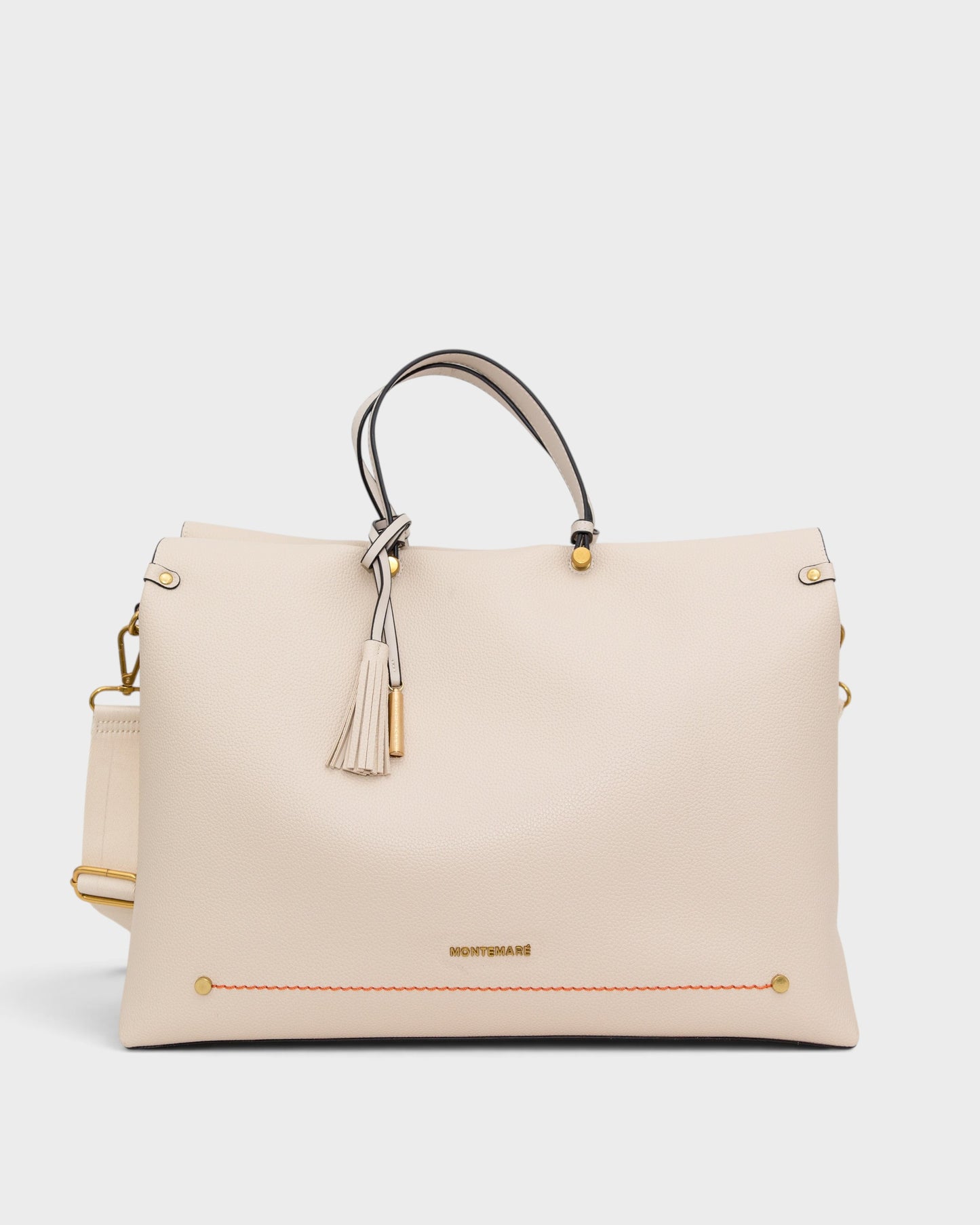 White handbag with gold accents on a white background
