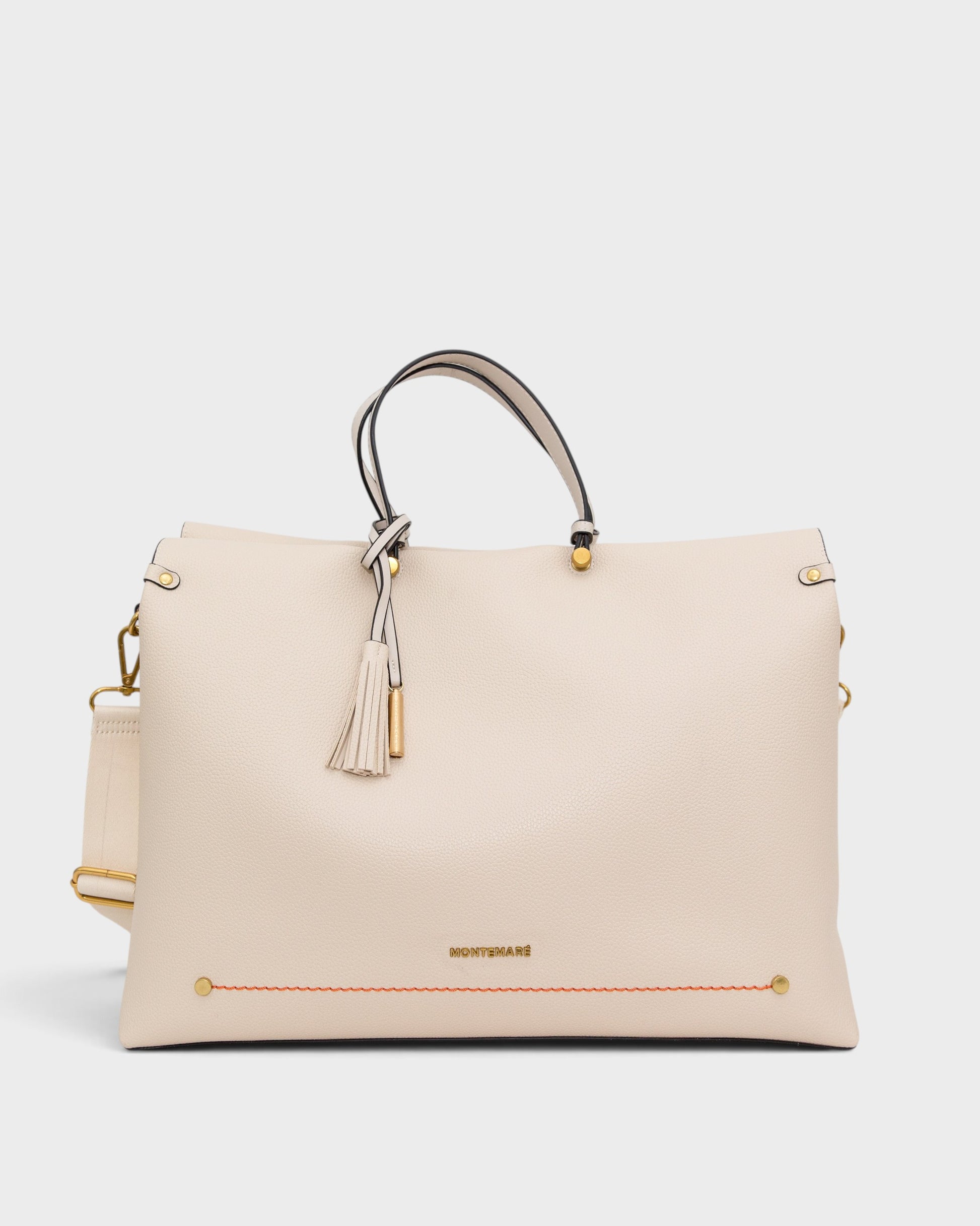 White handbag with gold accents on a white background