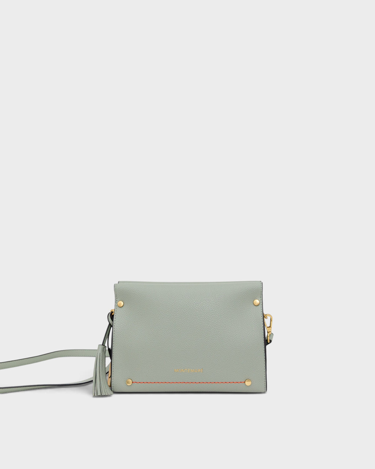 Light blue handbag with gold accents on a white background