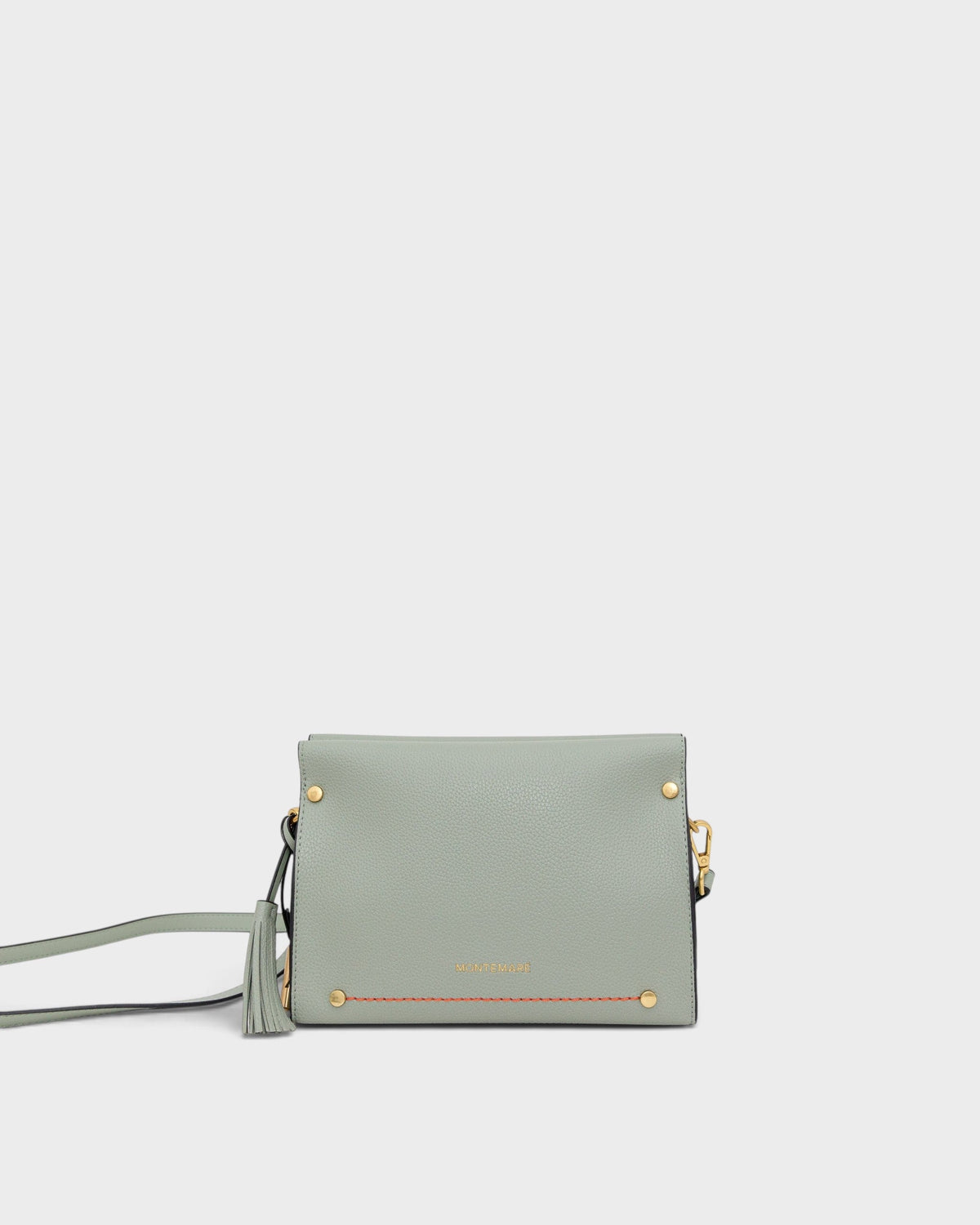 Light blue handbag with gold accents on a white background