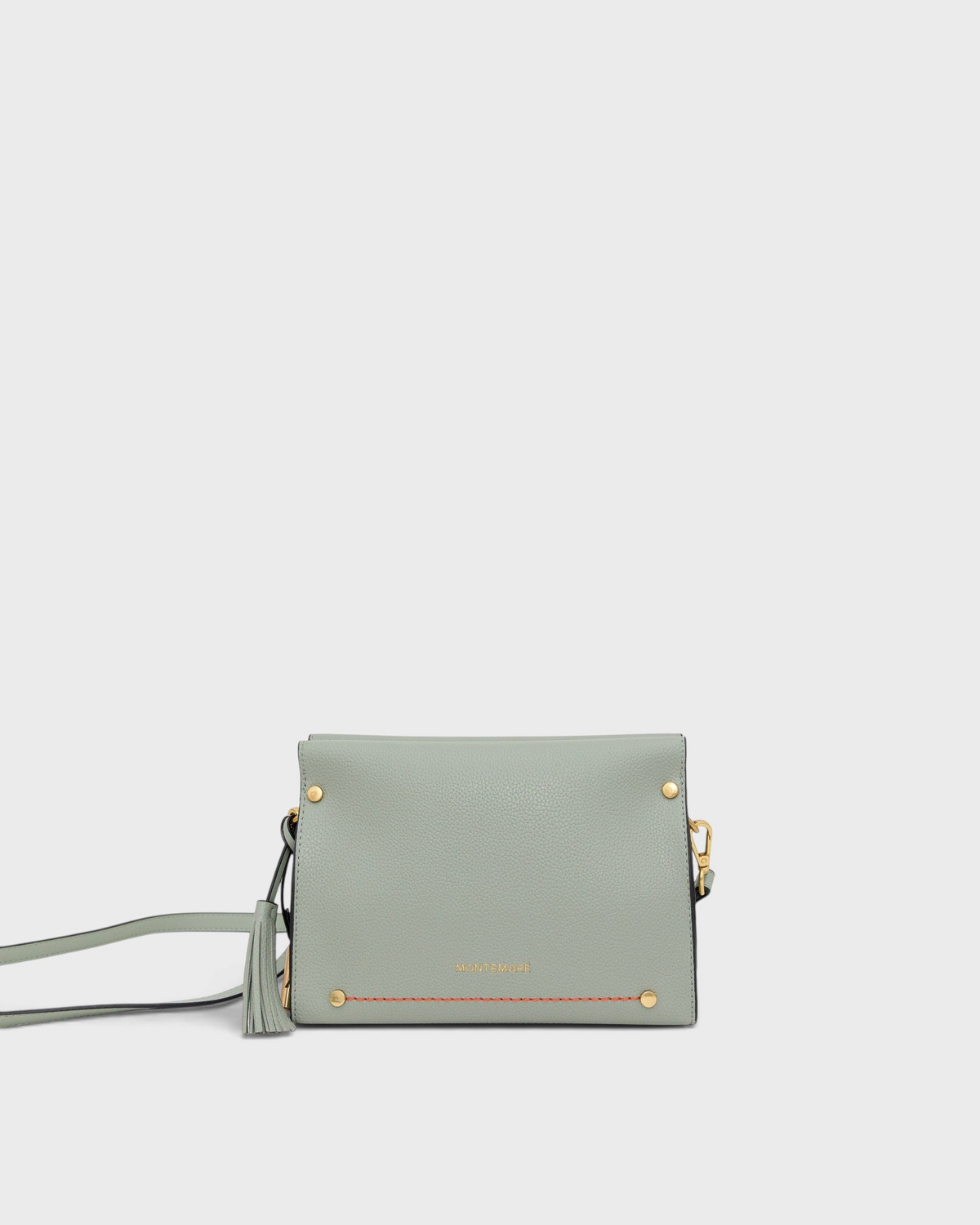 Light blue handbag with gold accents on a white background