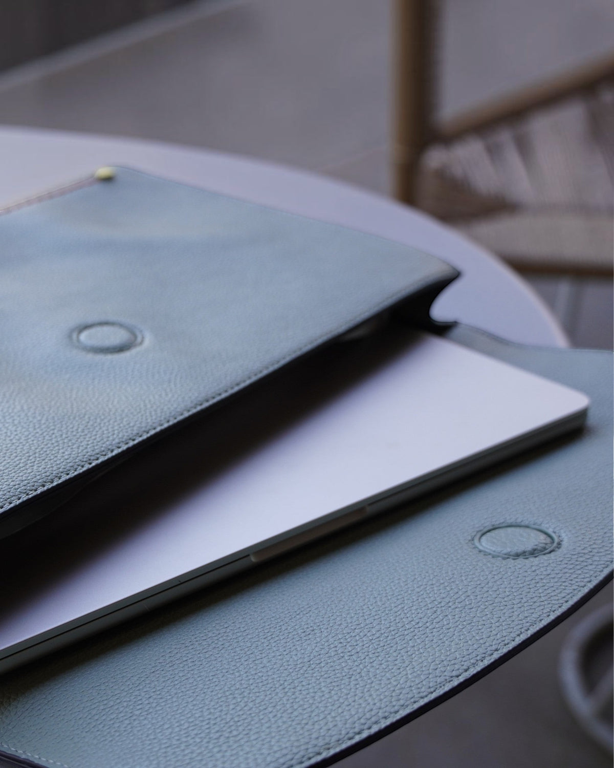 Close up shot of Montemare Vienna Laptop Case in Blake's Blue colorway with a laptop inside it