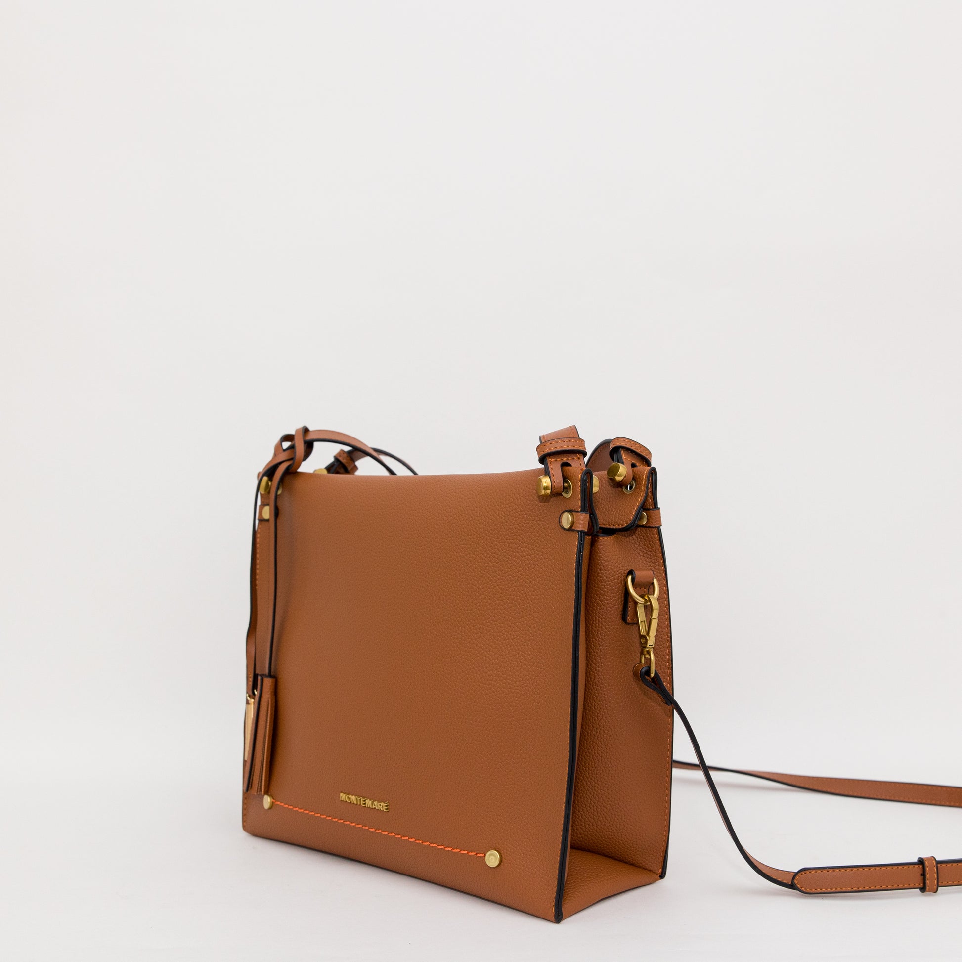 Brown leather handbag with gold accents on a white background