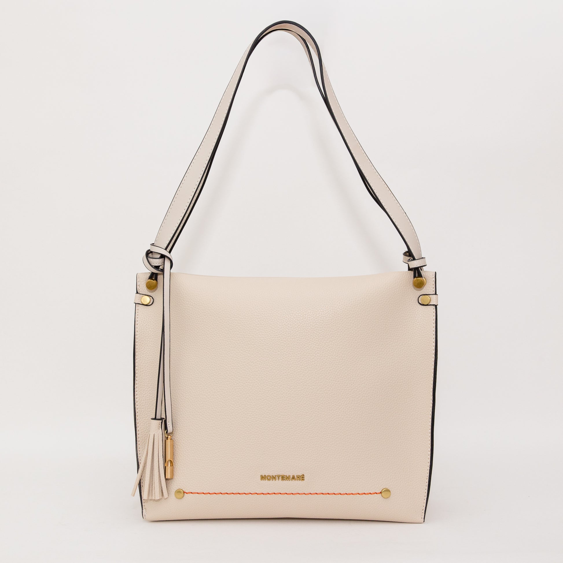 White handbag with gold accents on a white background